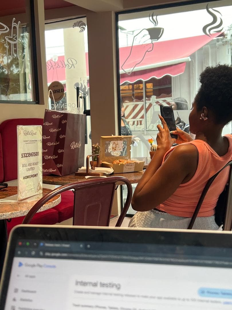 A guest photographing the counter at Roll and Roast in Ikoyi.
